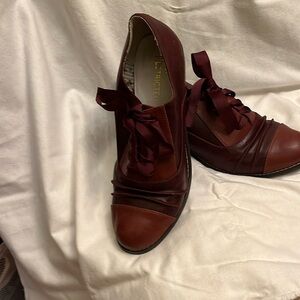 Restricted Burgundy two tone lace up  2.5” heal gently warn. Ribbon laces. Size9